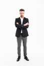 Full-length portrait of handsome businessman in suit posing on c Royalty Free Stock Photo