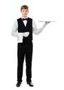 Full length portrait of handsome elegant waiter holding empty si Royalty Free Stock Photo