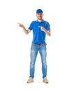 Full length portrait of handsome man in blue uniform pointing to Royalty Free Stock Photo