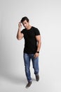 Full length portrait of handsome  man in casual clothes on grey background Royalty Free Stock Photo