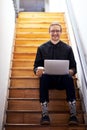 One is always busy when building a brand. Full length portrait of a handsome young businessman sitting alone on the