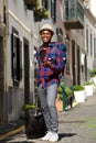 Full length happy african american travel man walking with bags and mobile phone on street Royalty Free Stock Photo