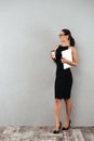 Full length portrait of a happy attractive businesswoman Royalty Free Stock Photo