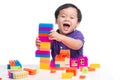 kid playing with block toys, asian small boy playing indoor games, colorful plastic block toys, making toy house, over white Royalty Free Stock Photo