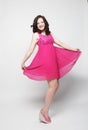 Full length portrait of happy beautiful woman in pink dress Royalty Free Stock Photo