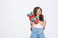 Portrait of a happy cheerful woman in sunglasses posing with skateboard while standing isolated over white background Royalty Free Stock Photo