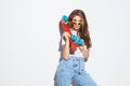 Portrait of a happy cheerful woman in sunglasses posing with skateboard while standing isolated over white background Royalty Free Stock Photo