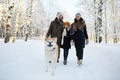 Family Walking Dog in Winter Royalty Free Stock Photo
