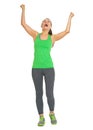 Full length portrait of happy fitness woman rejoicing success Royalty Free Stock Photo