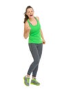 Full length portrait of happy fitness woman rejoicing success Royalty Free Stock Photo