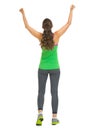 Full length portrait of happy fitness woman rejoicing success Royalty Free Stock Photo