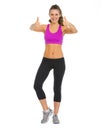 Happy fitness young woman showing thumbs up Royalty Free Stock Photo