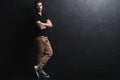 Full length portrait of happy handsome young man on black background. Royalty Free Stock Photo