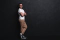 Full length portrait of happy handsome young man on black background. Royalty Free Stock Photo