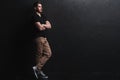 Full length portrait of happy handsome young man on black background. Royalty Free Stock Photo