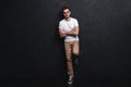 Full length portrait of happy handsome young man isolated on black background. Royalty Free Stock Photo