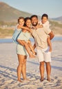 Full length portrait of a happy mixed race family standing together on the beach. Loving parents spending time with Royalty Free Stock Photo