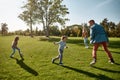 Happy memories. Excited family running outdoors on a sunny day Royalty Free Stock Photo