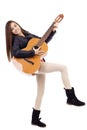 Full length portrait of happy teenage girl playing guitar Royalty Free Stock Photo