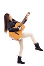 Full length portrait of happy teenage girl playing guitar Royalty Free Stock Photo