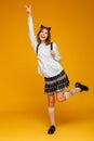 Full length portrait of a happy teenage schoolgirl Royalty Free Stock Photo