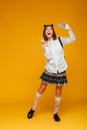 Full length portrait of a happy teenage schoolgirl in uniform Royalty Free Stock Photo