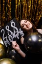 Full length portrait of a happy young casual woman holding a blank signboard Royalty Free Stock Photo