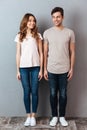 Full length portrait of a happy young couple standing