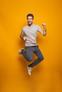 Full length portrait of a happy young man Royalty Free Stock Photo