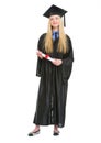 Happy young woman in graduation gown with diploma Royalty Free Stock Photo