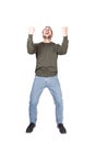 Full length portrait hysterical and passionate young man winner, keeps fists tight, shouting and screaming, isolated on white Royalty Free Stock Photo