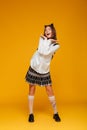 Full length portrait of a joyful teenage schoolgirl in uniform Royalty Free Stock Photo