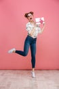 Full length portrait of a joyful young girl in sunglasses