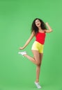 Full length portrait of joyous girl 20s dressed in summer clothes smiling and walking