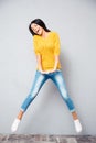 Full length portrait of a laughing woman jumping Royalty Free Stock Photo