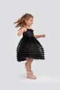 Full length portrait of a little smiling girl wearing beautiful Royalty Free Stock Photo