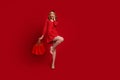 Full length portrait of lovely astonished fit perfect legs person hold store bags empty space isolated on red color