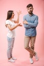 Full length portrait of a mad young couple Royalty Free Stock Photo