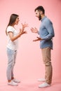 Full length portrait of a mad young couple Royalty Free Stock Photo