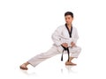 Male martial art practitioner stretching the leg