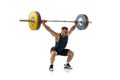 Full length portrait of a man in sportswear exercising with a weight isolated on white background Royalty Free Stock Photo