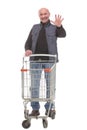 Full length portrait of a mature man returning an empty shopping cart Royalty Free Stock Photo