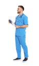 Full length portrait of medical doctor with clipboard and stethoscope isolated