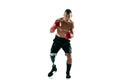 Full length portrait of muscular sportsman with prosthetic leg, copy space. Male boxer in red gloves. Royalty Free Stock Photo