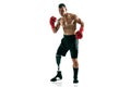 Full length portrait of muscular sportsman with prosthetic leg, copy space. Male boxer in red gloves. Royalty Free Stock Photo