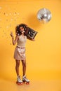 Full length portrait of overjoyed afro american disco woman in s Royalty Free Stock Photo