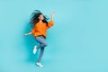 Full length portrait of pretty positive person enjoy free time dance look empty space  on teal color background Royalty Free Stock Photo