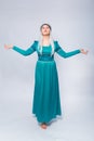 Full length portrait of a princess in a medieval, fantasy, turquoise dress with ash hair and a silver crown