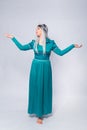 Full length portrait of a princess in a medieval, fantasy, turquoise dress with ash hair and a silver crown