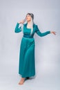 Full length portrait of a princess in a medieval, fantasy, turquoise dress with ash hair and a silver crown